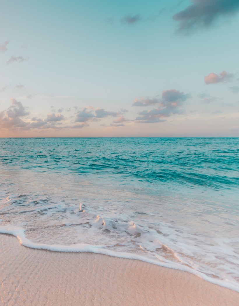 A turquoise beach at sunset